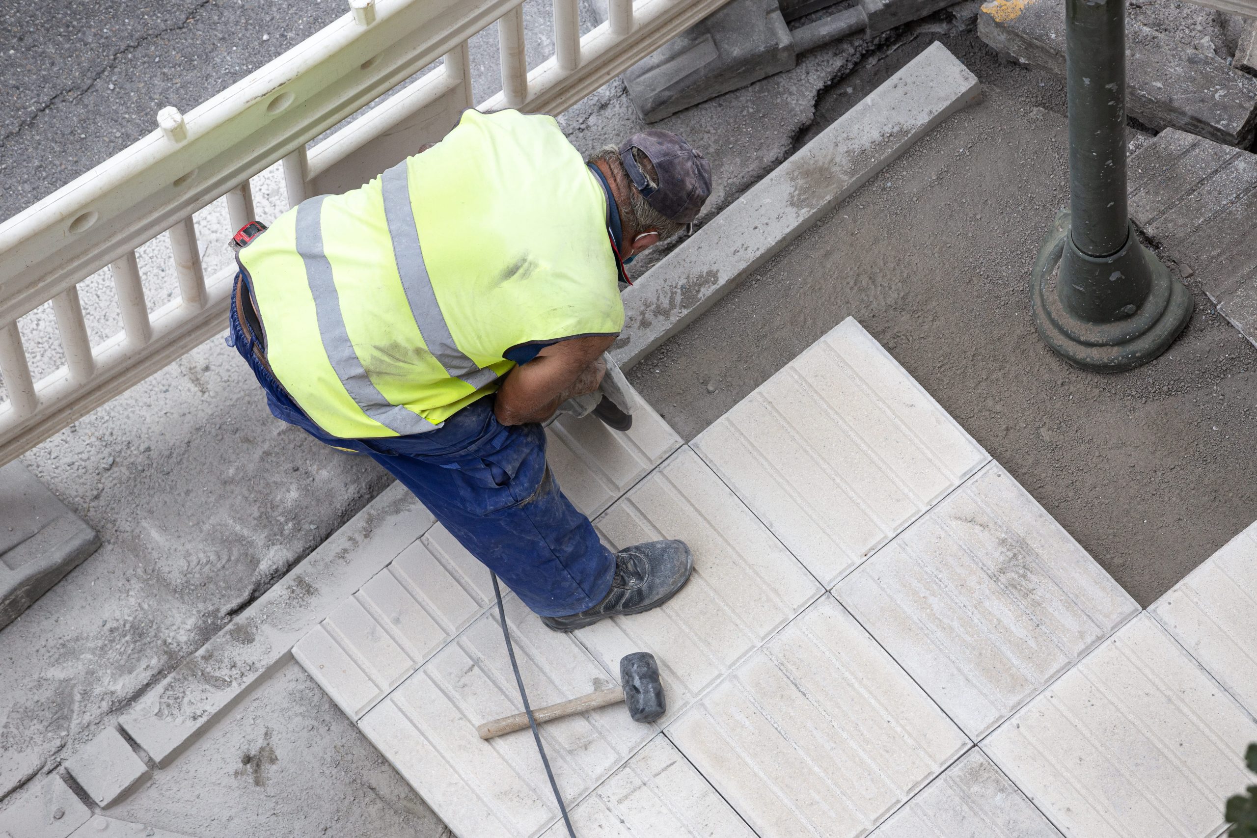 construction-worker-with-angle-grinder-repairing-a-2026-01-08-05-51-28-utc
